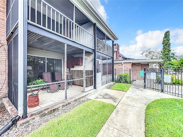 view of home's exterior featuring a patio and a balcony