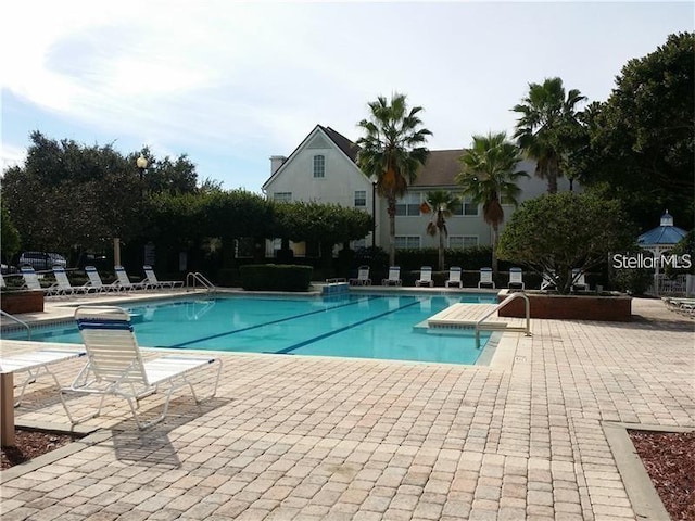 community pool with a patio