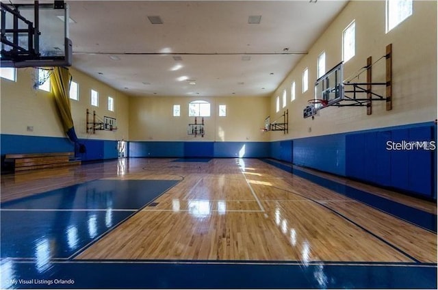 view of basketball court with community basketball court and a healthy amount of sunlight