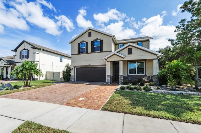 view of front of home featuring a front yard and a garage