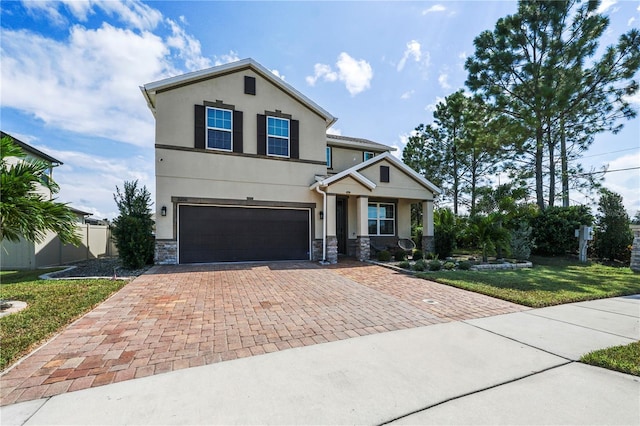 view of front of house with a front lawn and a garage