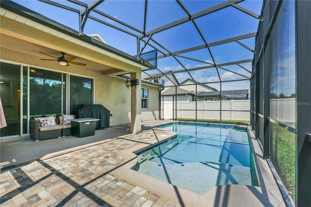 view of pool with ceiling fan, a lanai, an outdoor hangout area, and a patio area