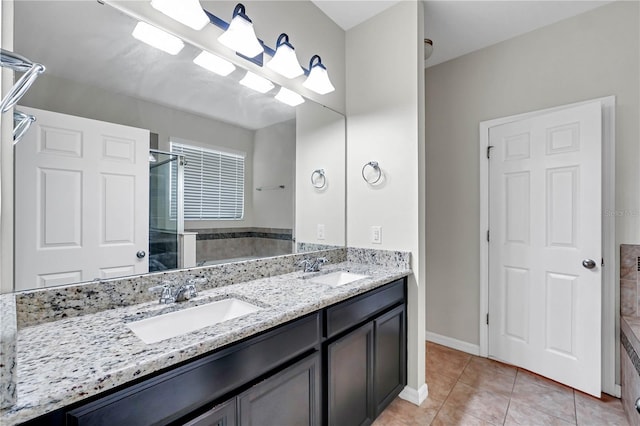 bathroom featuring tile patterned flooring, vanity, and walk in shower