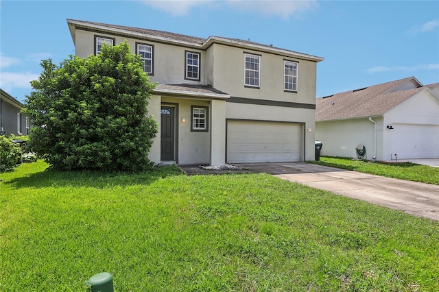 view of property featuring a garage and a front lawn