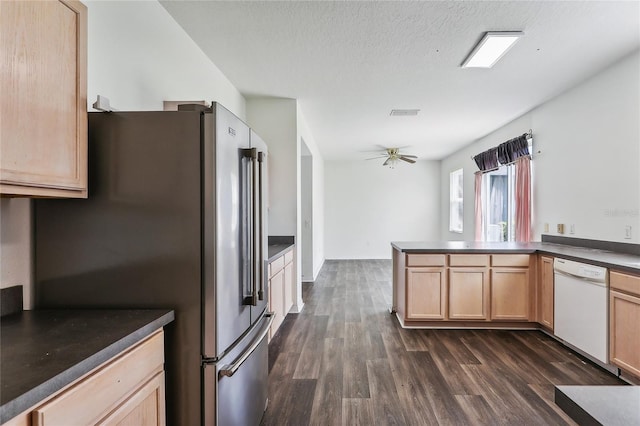 kitchen with dark hardwood / wood-style floors, high end fridge, white dishwasher, kitchen peninsula, and a textured ceiling