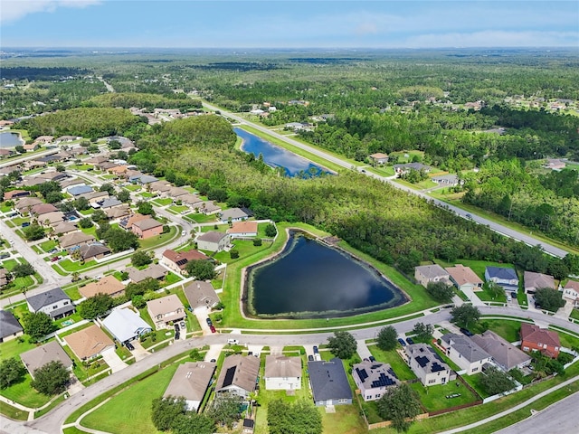 birds eye view of property featuring a water view and a residential view