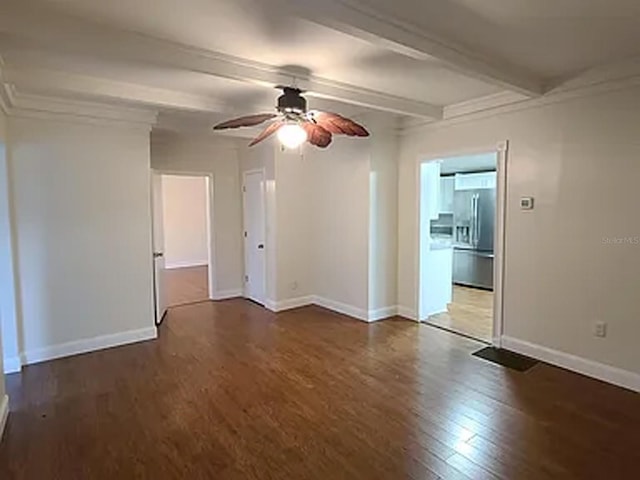 unfurnished room with ceiling fan, beamed ceiling, and wood-type flooring