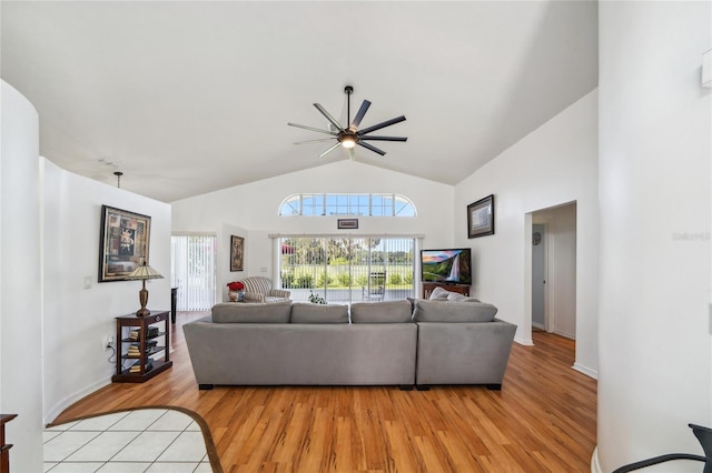 living room featuring light wood-type flooring, vaulted ceiling, and ceiling fan