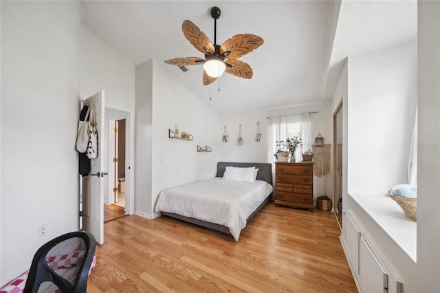 bedroom with ceiling fan, high vaulted ceiling, and light hardwood / wood-style floors