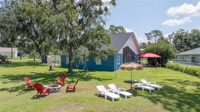 view of yard with a fire pit