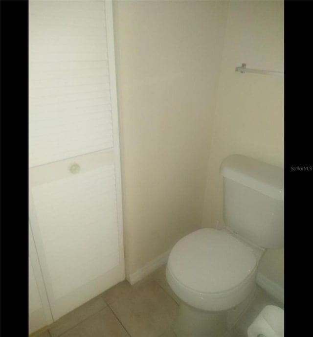 bathroom with tile patterned floors and toilet