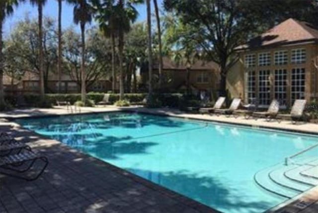 view of swimming pool with a patio