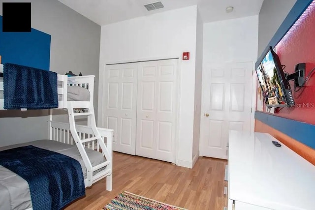 bedroom featuring a closet and hardwood / wood-style floors