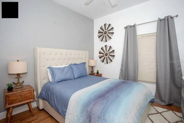 bedroom featuring light hardwood / wood-style floors and ceiling fan