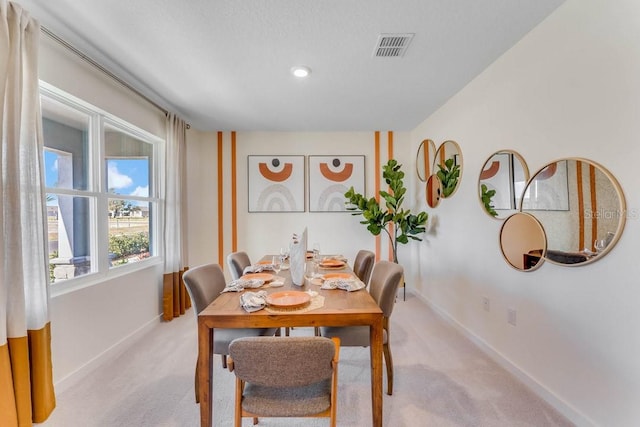 dining area with light carpet