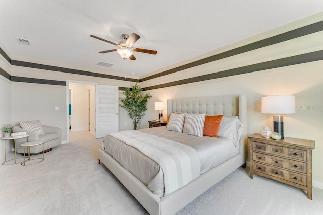 bedroom featuring ceiling fan and light carpet