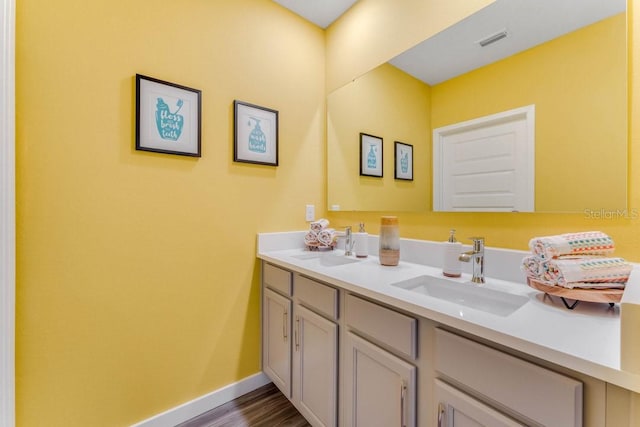 bathroom with vanity and hardwood / wood-style flooring