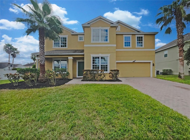 view of front of house featuring a garage and a front yard