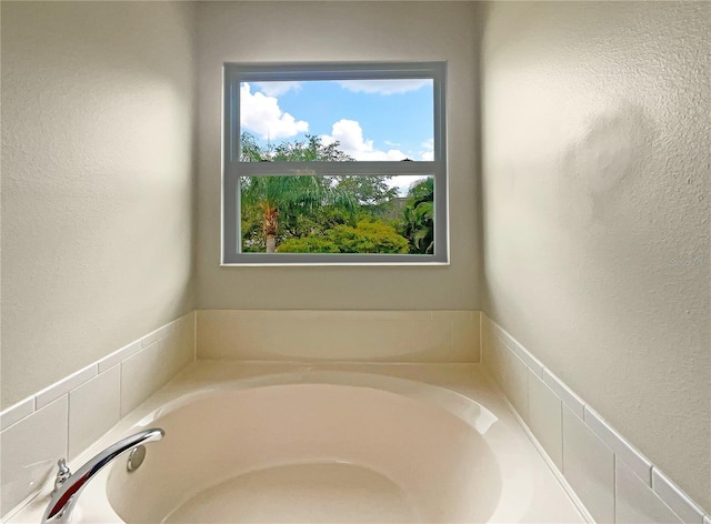 bathroom with a tub