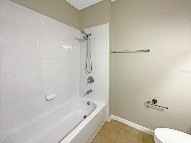 bathroom featuring  shower combination, tile patterned flooring, baseboards, and toilet