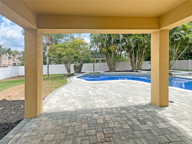 view of pool featuring a patio area, a fenced backyard, a fenced in pool, and a hot tub