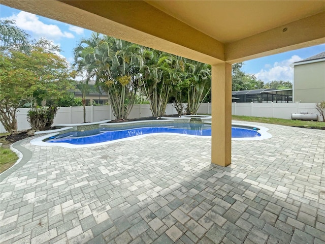 view of swimming pool featuring a patio area, a fenced backyard, a fenced in pool, and an in ground hot tub