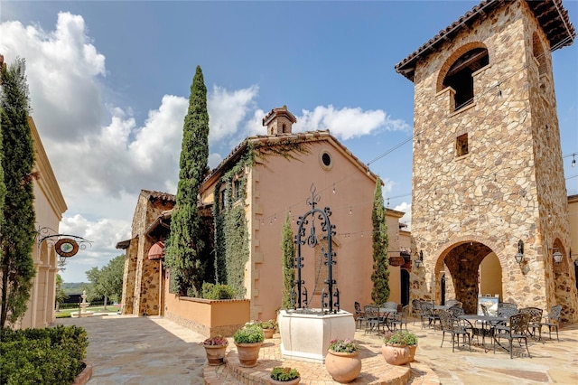 view of property's community with a patio area