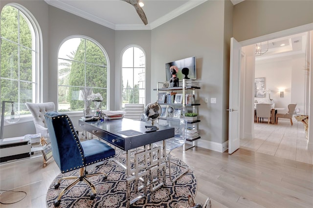 office featuring ornamental molding, wood finished floors, and baseboards