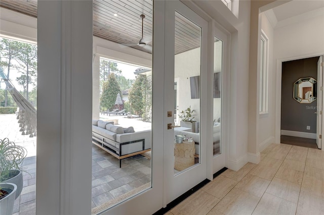 entryway featuring baseboards