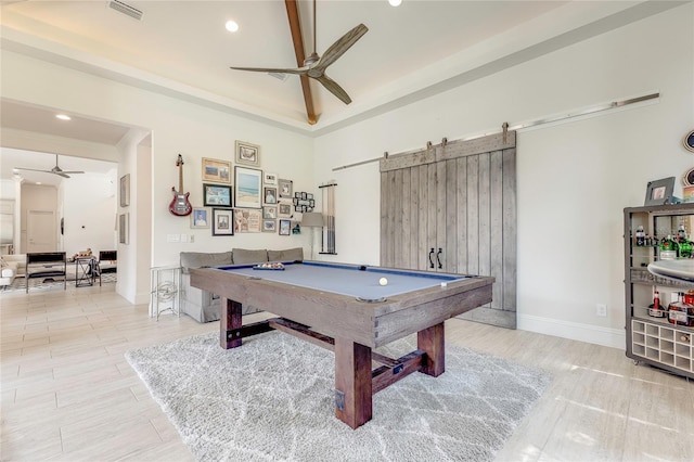 recreation room with visible vents, a barn door, a ceiling fan, billiards, and baseboards