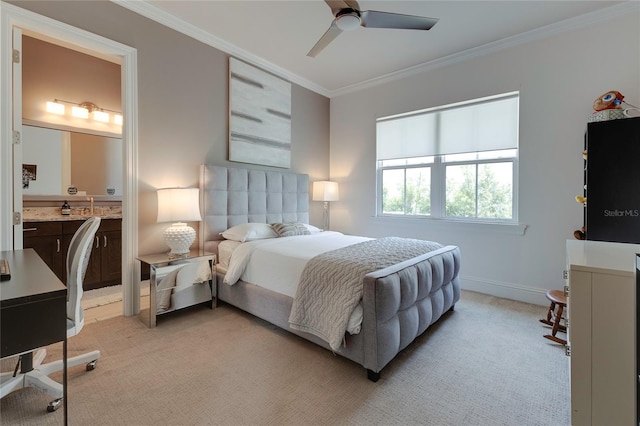 bedroom featuring ornamental molding, light carpet, connected bathroom, ceiling fan, and baseboards