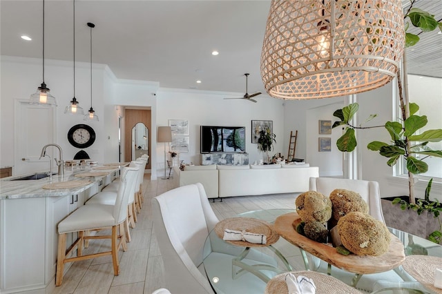 dining room featuring a ceiling fan, recessed lighting, and crown molding