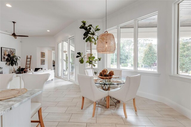 dining room with plenty of natural light, baseboards, a ceiling fan, and recessed lighting