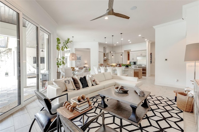 living room with a ceiling fan, recessed lighting, crown molding, and baseboards