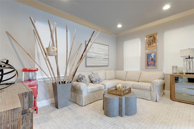 living room with ornamental molding, recessed lighting, and baseboards