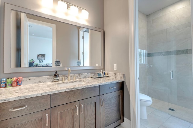 bathroom with toilet, a stall shower, tile patterned floors, and vanity