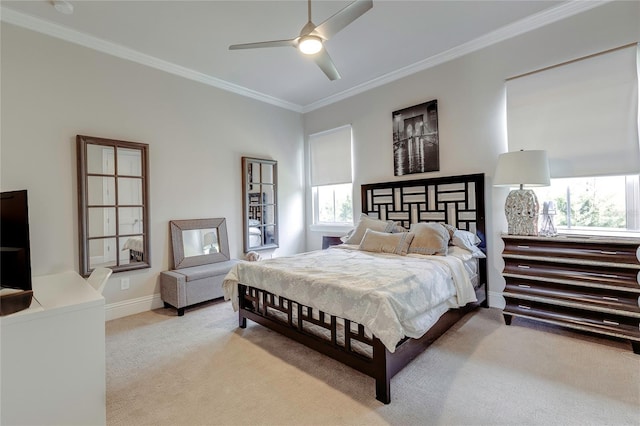 bedroom featuring ornamental molding, carpet, a ceiling fan, and baseboards