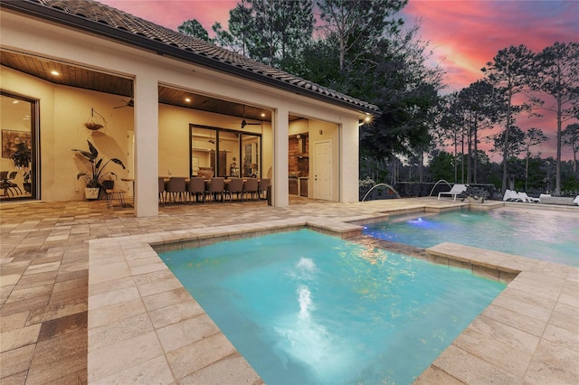 pool featuring a patio area and ceiling fan