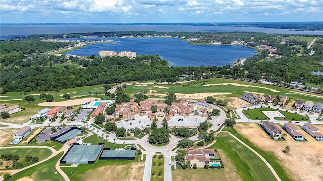 aerial view with a residential view, a water view, and golf course view