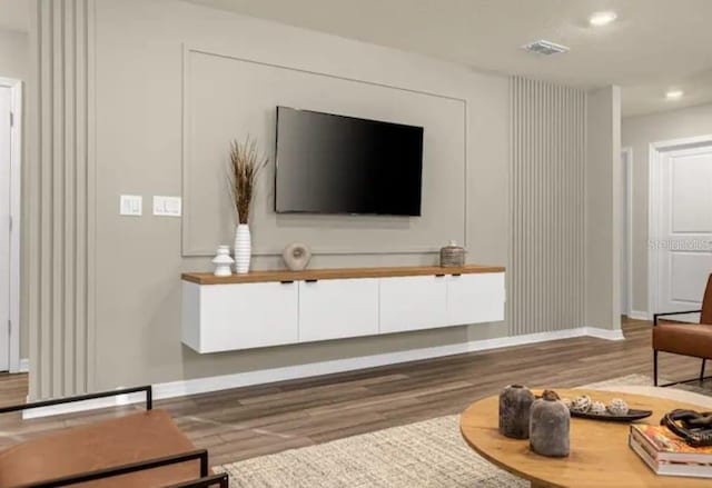 4424 Kaipo Rd, Davenport, FL 33897 - living room featuring baseboards, visible vents, recessed lighting, and wood finished floors