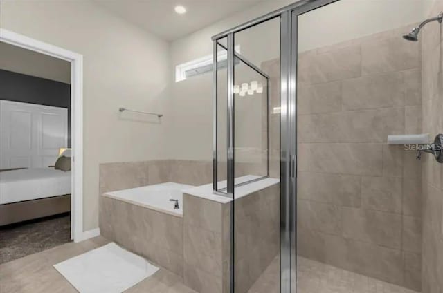 bathroom with independent shower and bath and tile patterned floors