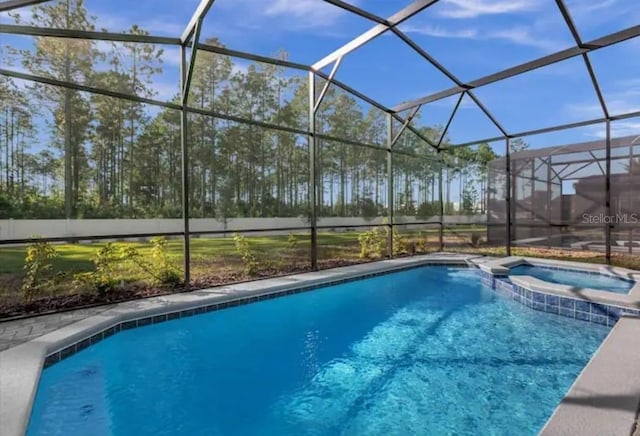 view of swimming pool featuring an in ground hot tub and a lanai