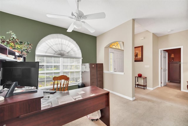 home office featuring ceiling fan and light carpet