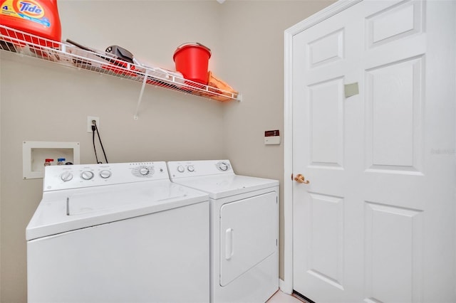 laundry room with independent washer and dryer