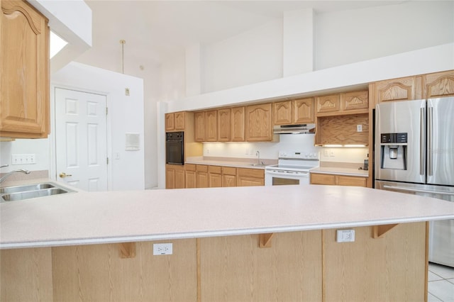 kitchen featuring light countertops, stainless steel refrigerator with ice dispenser, a sink, and white electric range oven