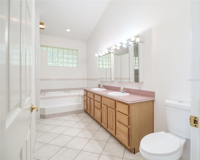 full bathroom featuring a bath, tile patterned flooring, and a sink