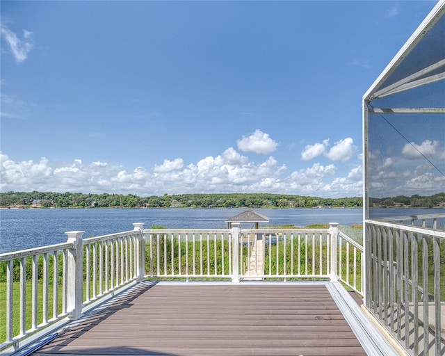 wooden deck featuring a water view