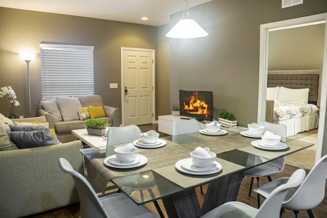 dining area with hardwood / wood-style floors