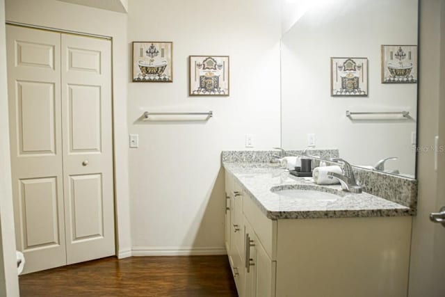 bathroom with vanity and hardwood / wood-style floors