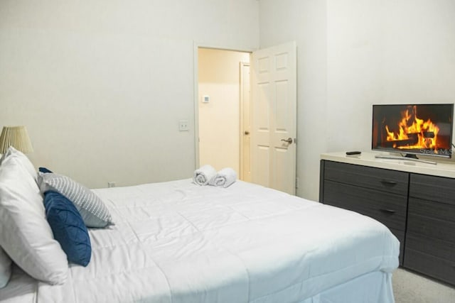 bedroom featuring light carpet